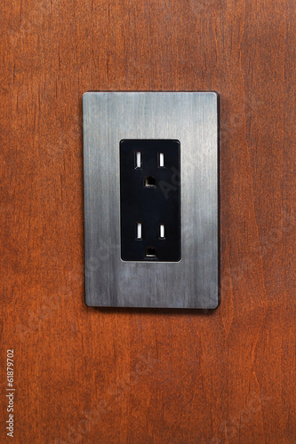 Dual Electrical Outlet on Wooden Wall