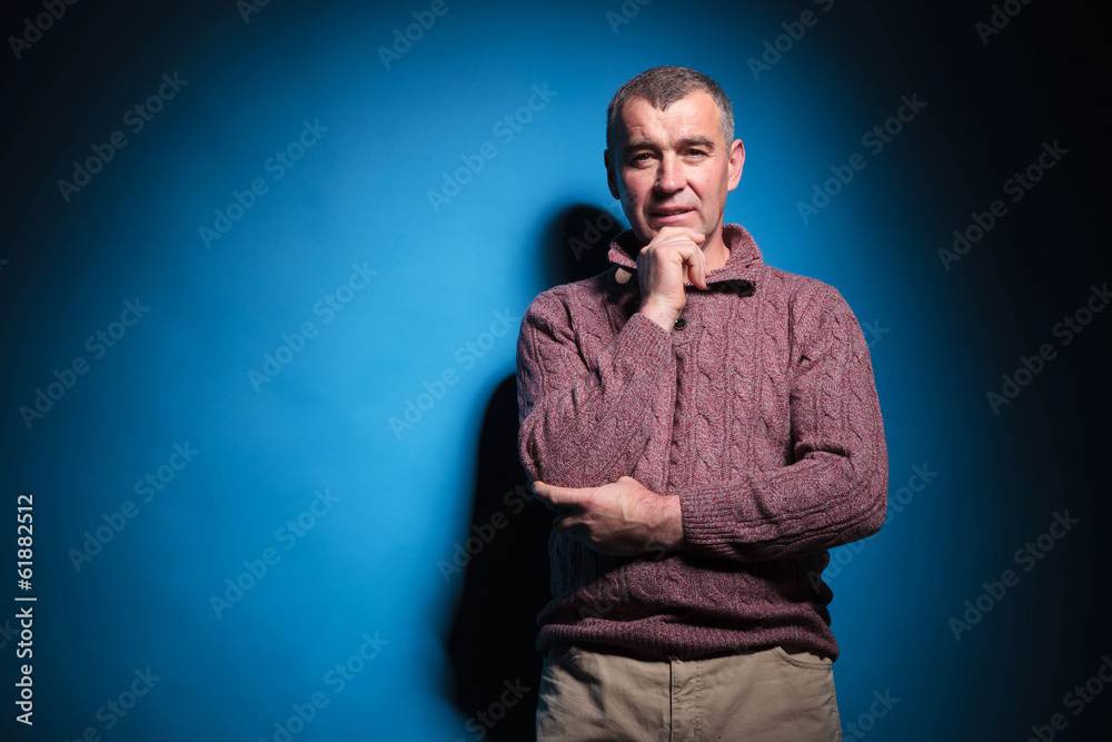 senior casual man looks pensively at you senior casual man looks pensively at you