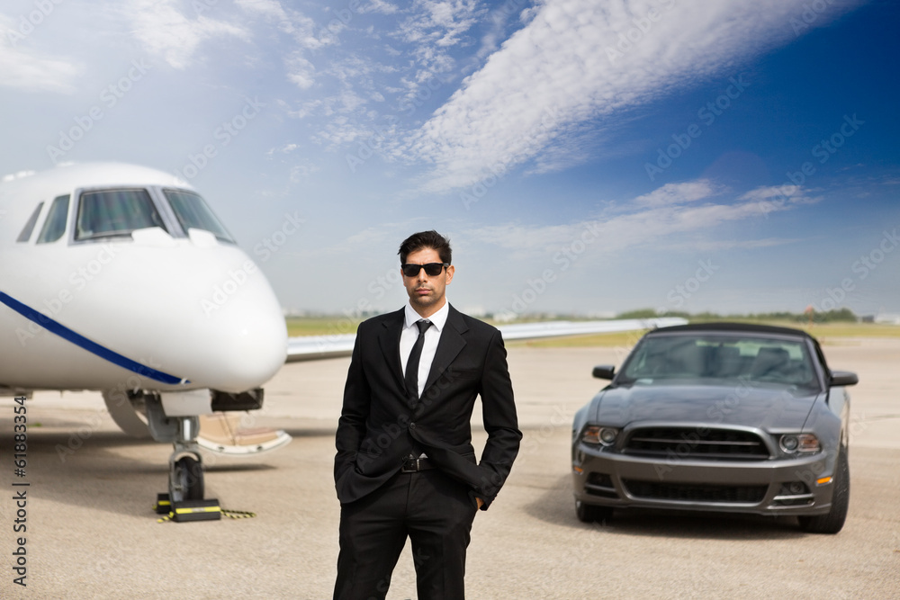 Entrepreneur Standing In Front Of Car And Private Jet Entrepreneur Standing In Front Of Car And Private Jet
