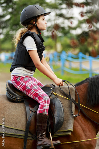 Horse riding, portrait of lovely equestrian on a horse
