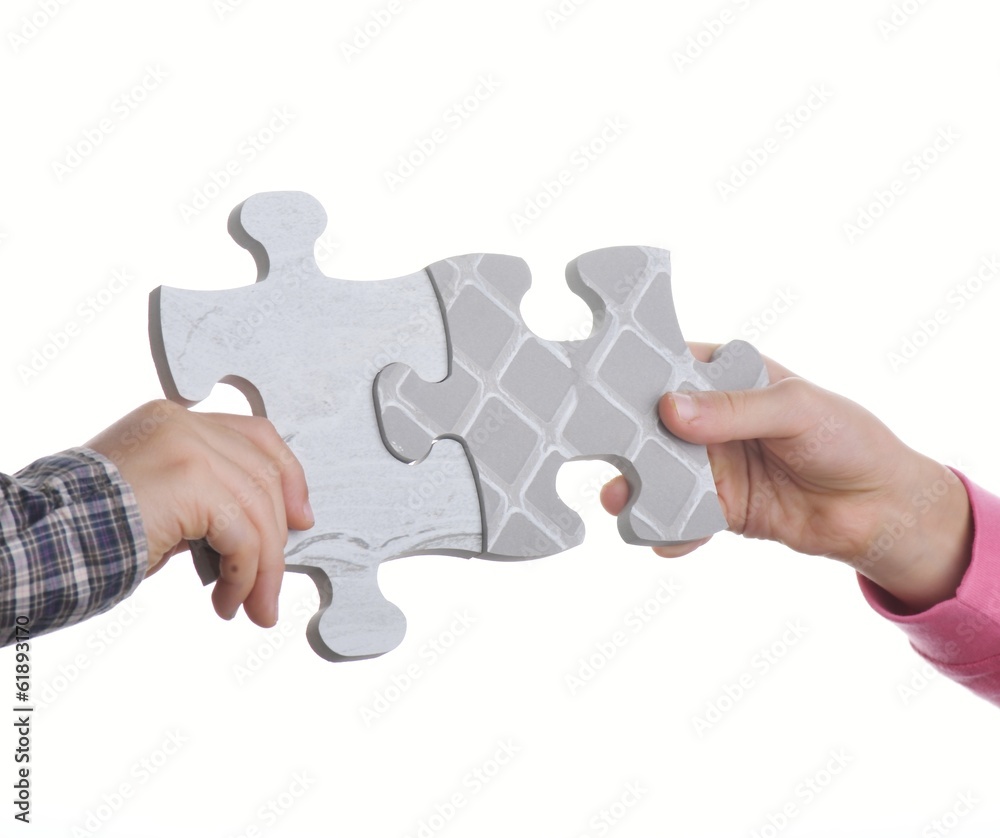 Kids connecting the jigsaw puzzle Kids connecting the jigsaw puzzle
