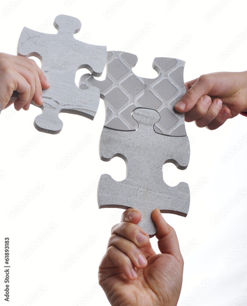 Kids connecting the jigsaw puzzle Kids connecting the jigsaw puzzle