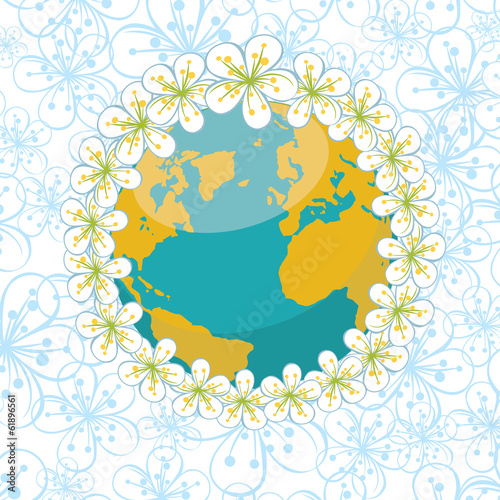 Planet earth with wreath of spring flowers on flowers background photo