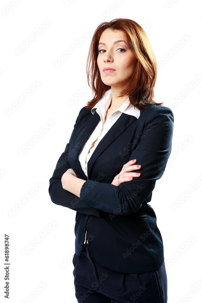 Pensive businesswoman standing with arms folded Pensive businesswoman standing with arms folded