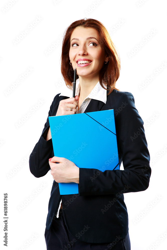 Thoughtful businesswoman holding pen with notebook Thoughtful businesswoman holding pen with notebook