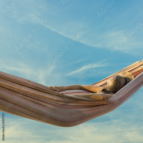 Woman relaxing in a hammock