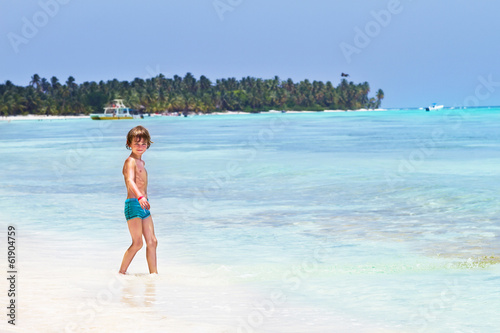 Cute little boy playing on the beach