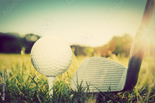 Playing golf, ball on tee and golf club. Vintage, retro style