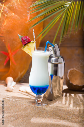 Blue Curacao cocktail with slice of ananas photo