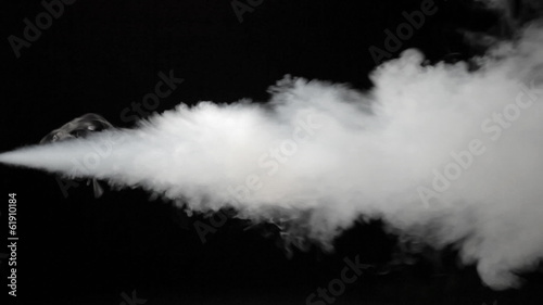 White spray of smoke isolated on black