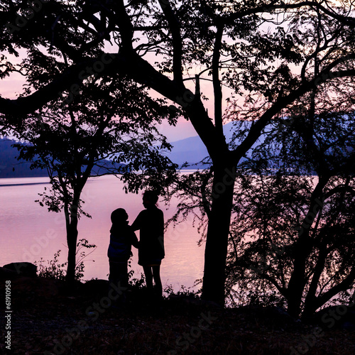 silhouette love mom and son with dusk