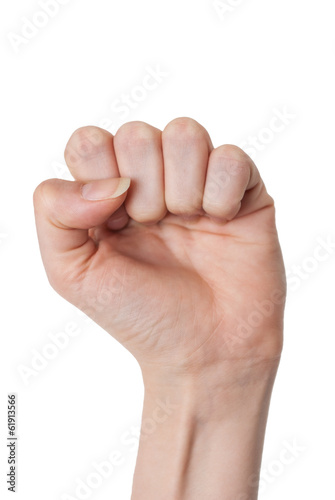 Closeup of female hand closed clenched fist rebel sign