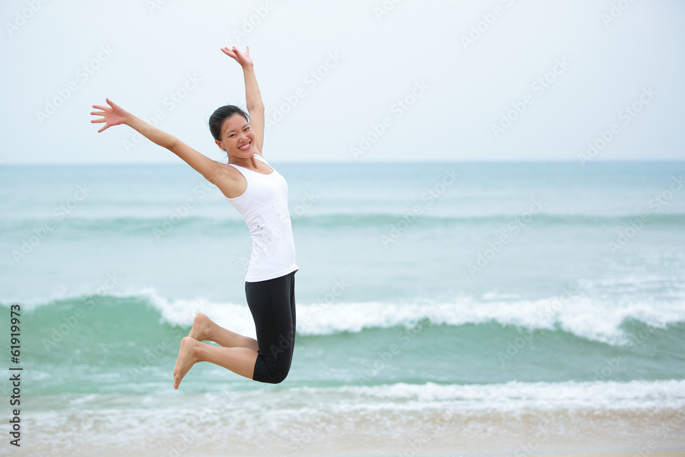Happy woman jumping on the beach. summer holidays Happy woman jumping on the beach. summer holidays
