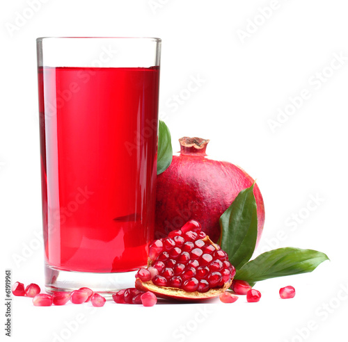 ripe pomergranate and glass of juice isolated on white.