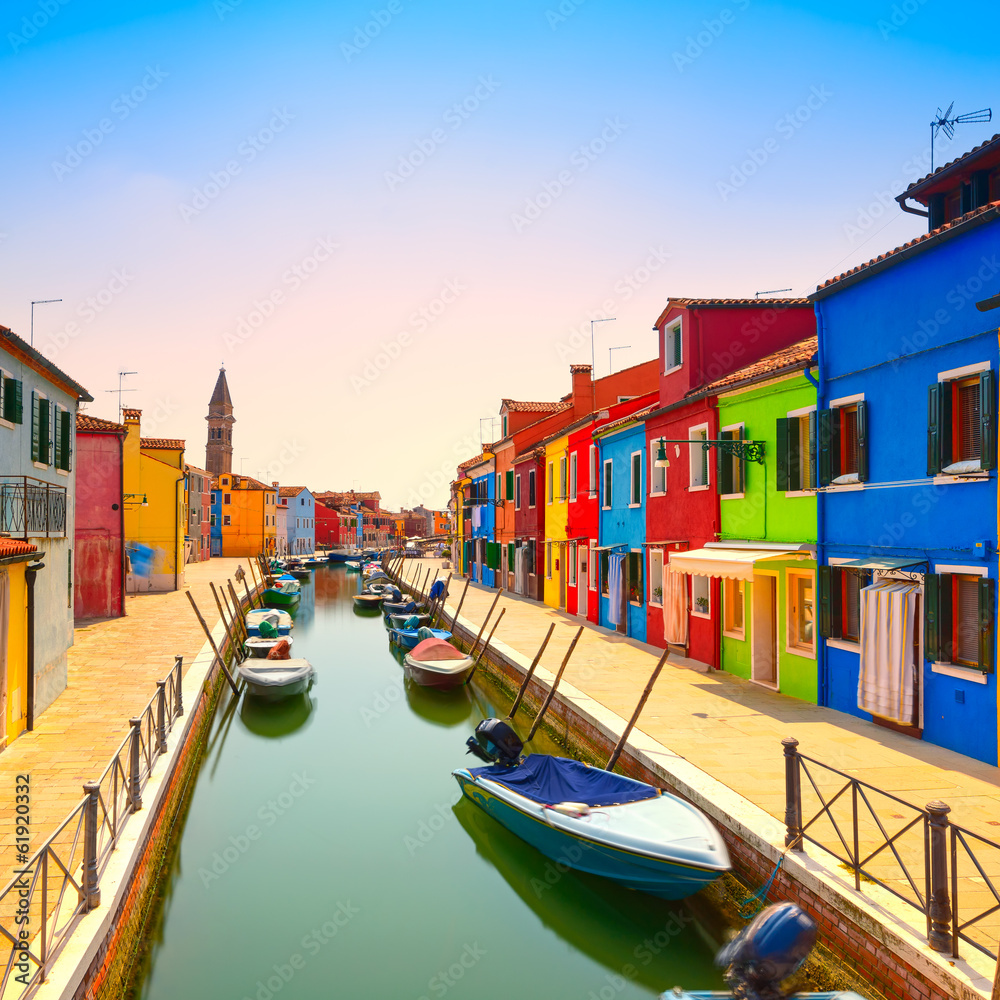 Venice landmark, Burano island canal, colorful houses and boats,