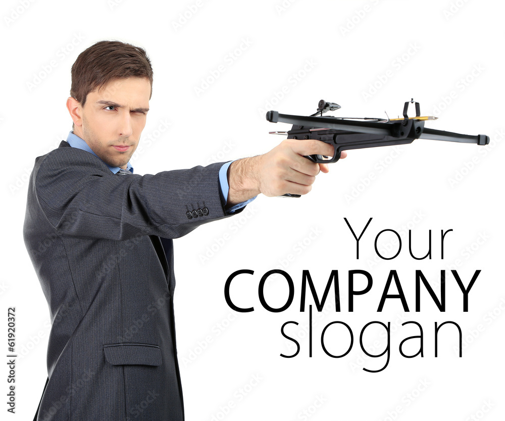 Young businessman with crossbow, isolated on white Young businessman with crossbow, isolated on white