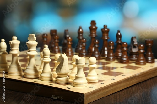 Wallpaper Mural Chess pieces on board on bright background Torontodigital.ca