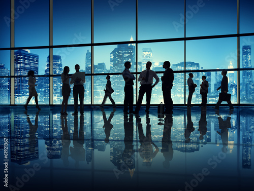 Business People in Office with City Backdrop
