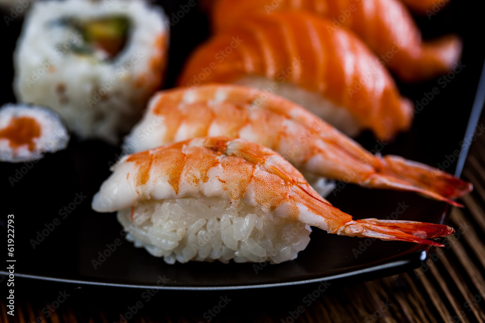 Japanese concept with sushi on the wooden table Japanese concept with sushi on the wooden table