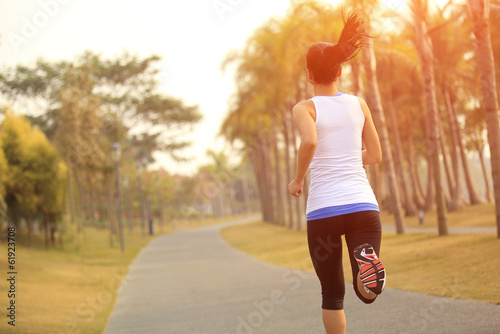 Fototapeta Naklejka Na Ścianę i Meble -  fitness young woman jogging at tropical park