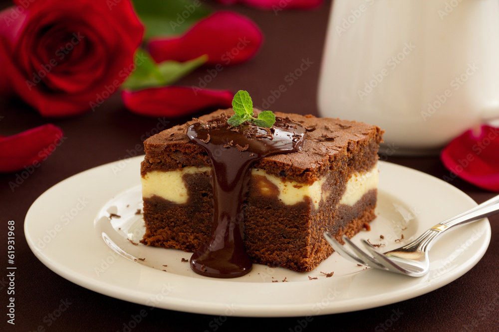 Chocolate brownie with cheese filling and chocolate sauce. Chocolate brownie with cheese filling and chocolate sauce.