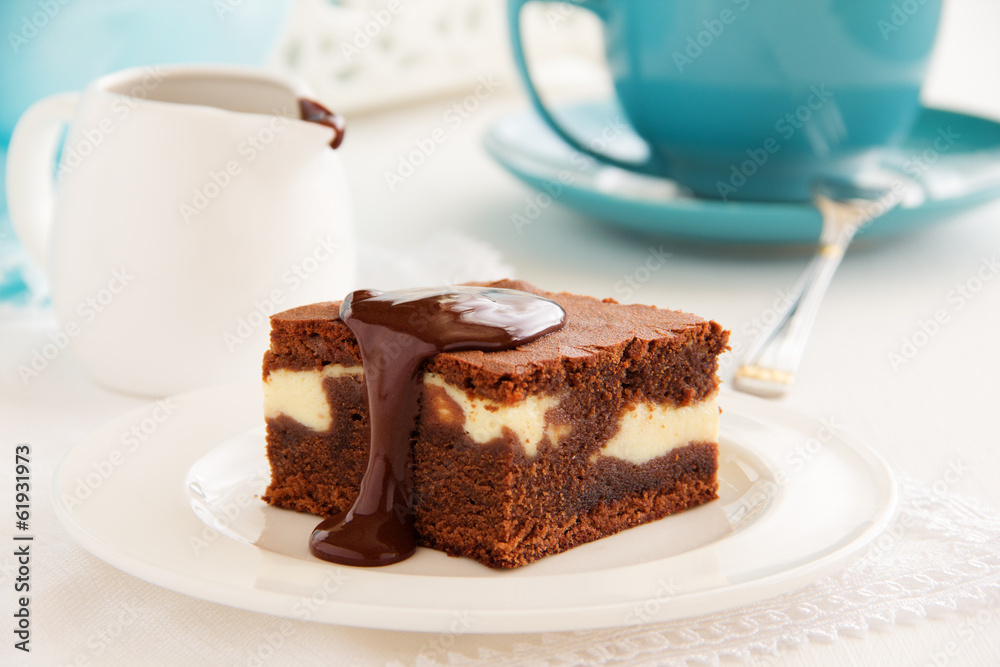Chocolate brownie with cheese filling and chocolate sauce. Chocolate brownie with cheese filling and chocolate sauce.