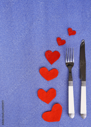 Valentines day dinner with table setting on blue background © Africa Studio