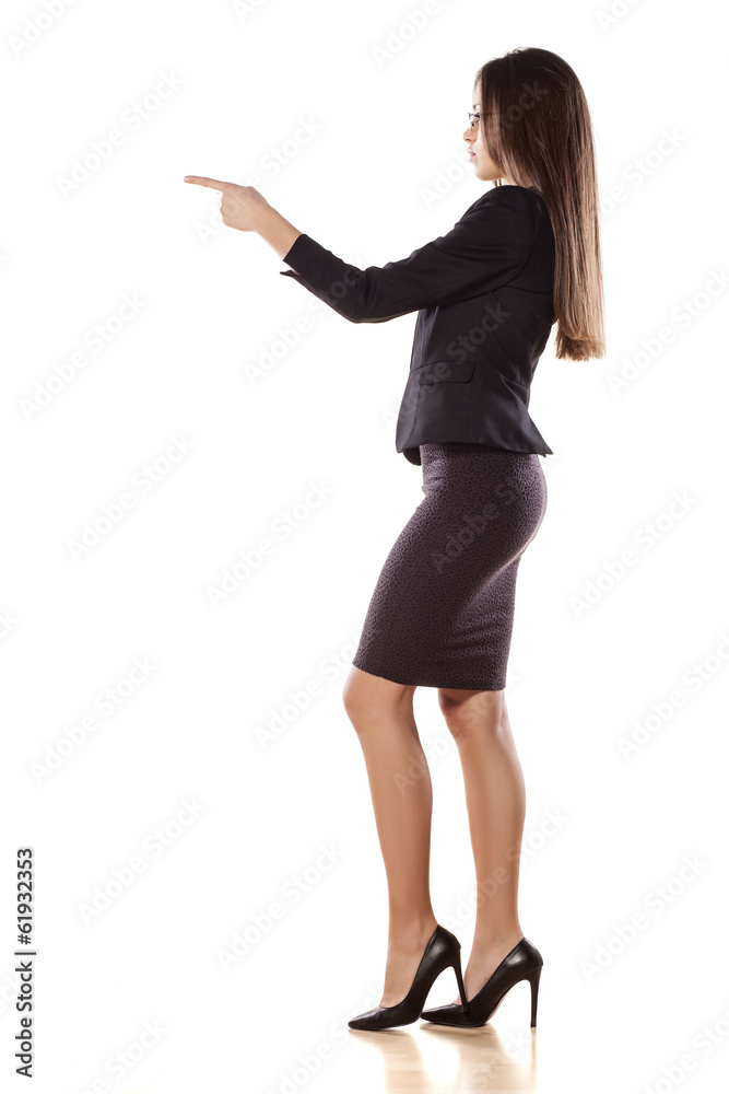 young business woman pointing with her finger on empty space young business woman pointing with her finger on empty space