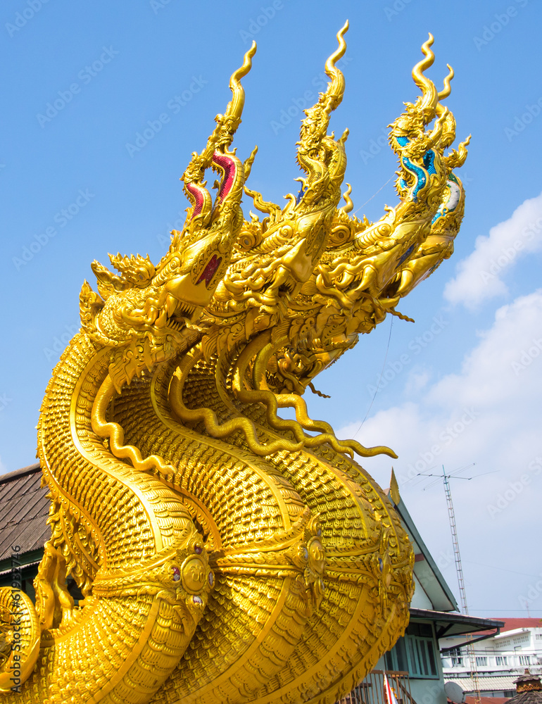 Fototapeta premium Golden king of Naga with sky at public temple