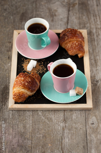 Coffee cups and croissants