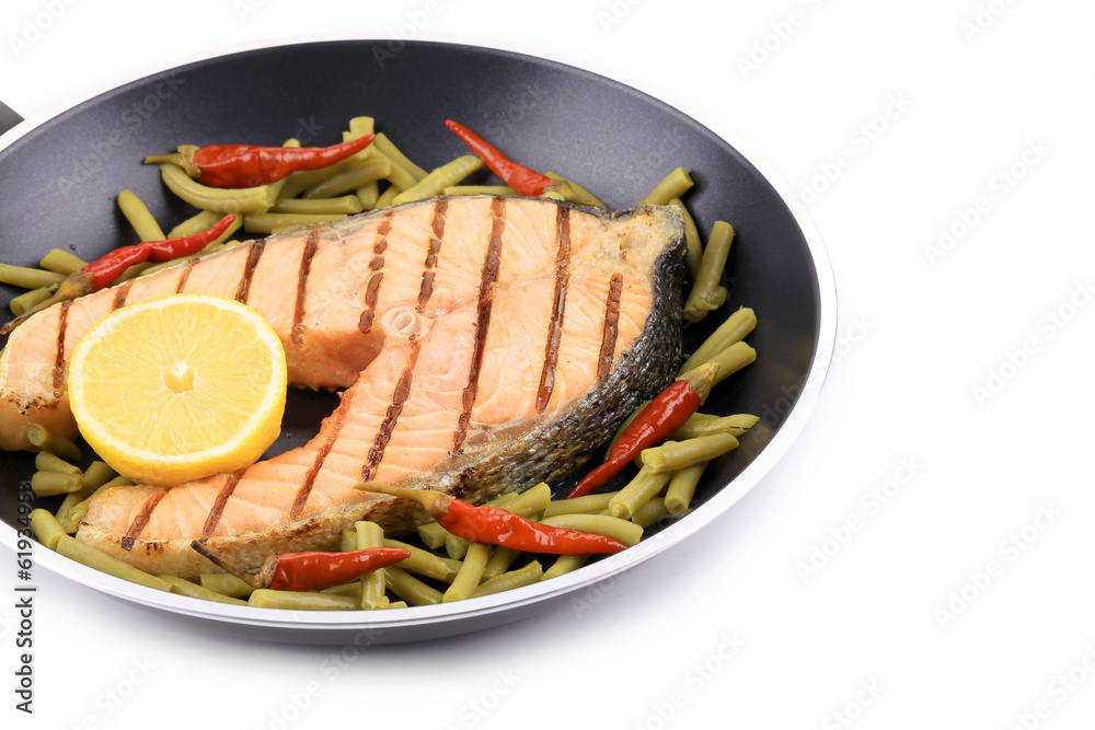 Frying pan with salmon steak. Frying pan with salmon steak.