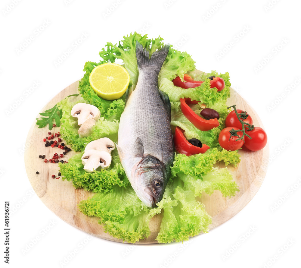 Fresh seabass on platter with lettuce.