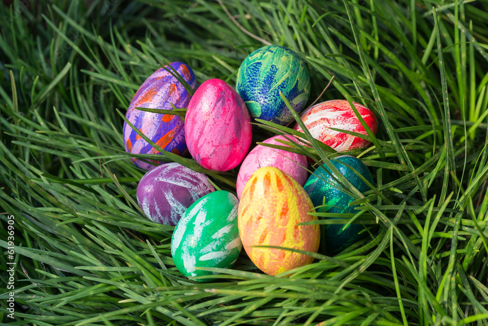 Easter eggs on the green grass background