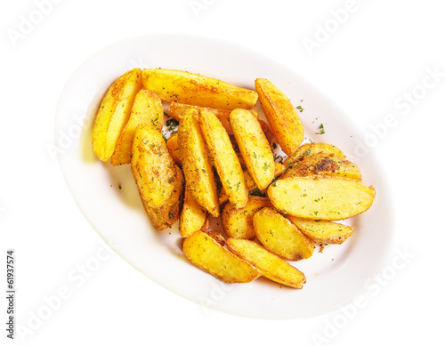 roasted potato wedges on a white plate
