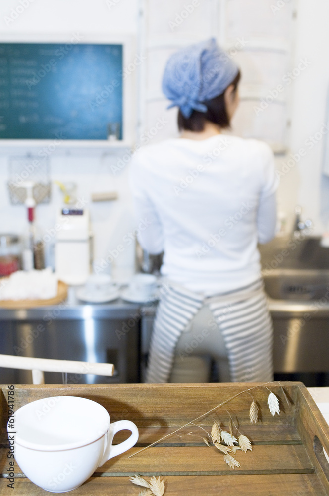 female cafe staff washing dishes female cafe staff washing dishes