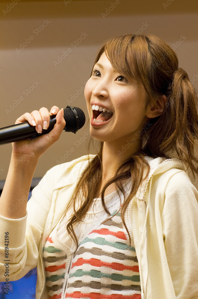 woman singing at karaoke