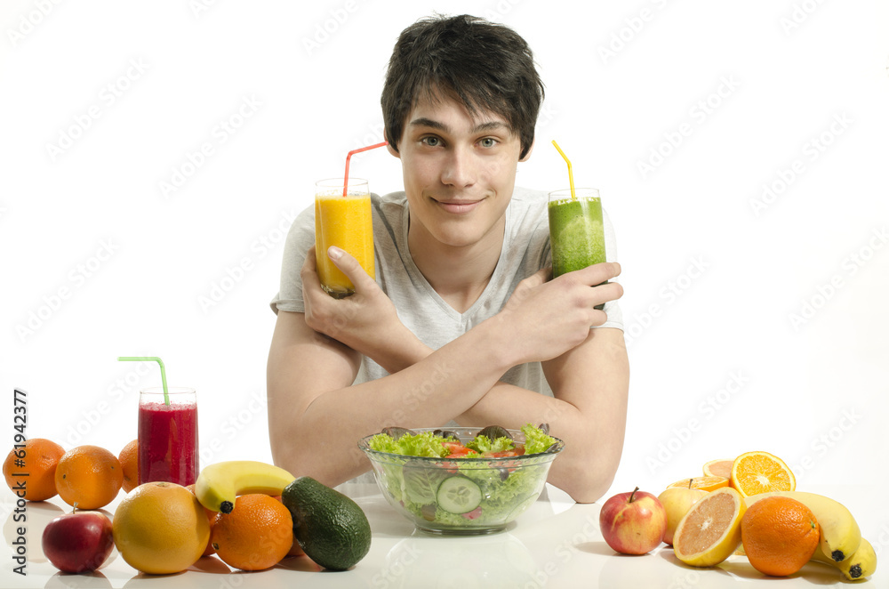 Happy man holding organic smoothie, fruits, salad,healthy food Happy man holding organic smoothie, fruits, salad,healthy food