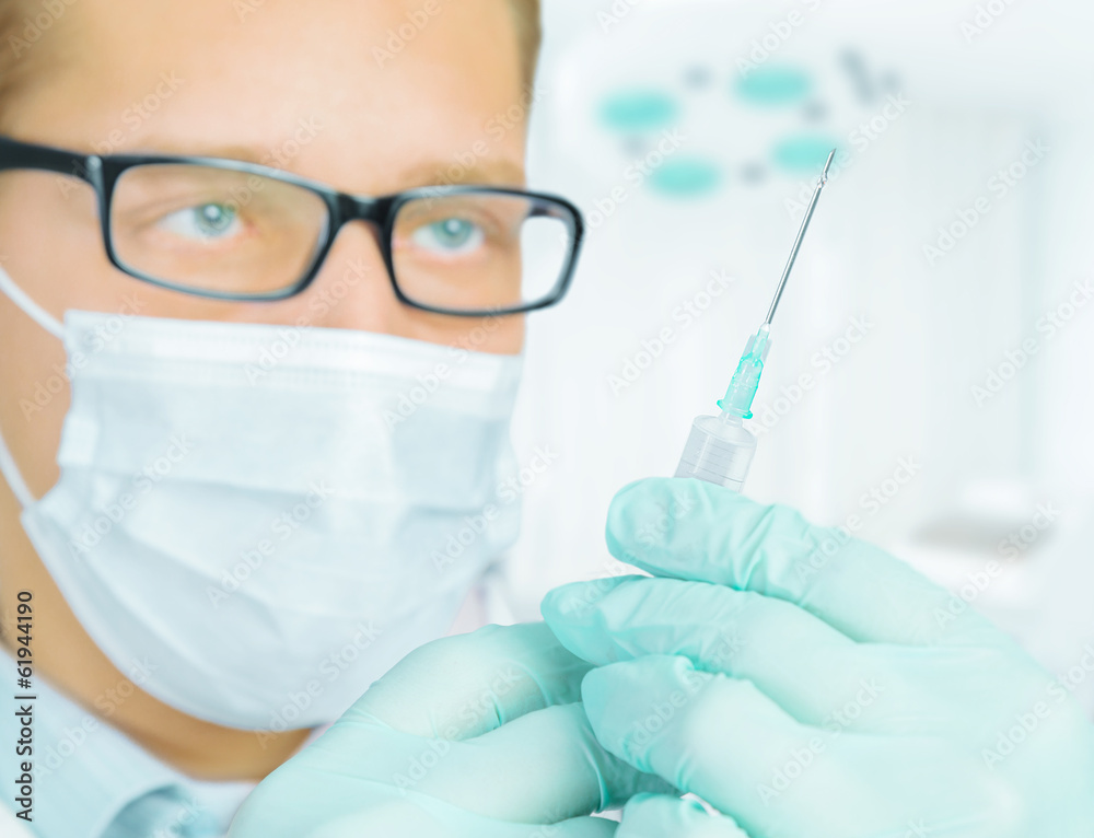 Portrait of a doctor with a syringe Portrait of a doctor with a syringe
