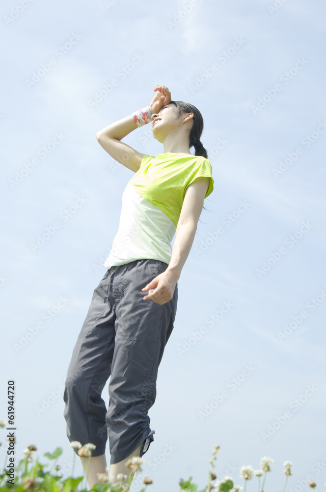 woman wiping sweat woman wiping sweat