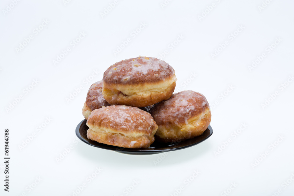 whole donuts on the black porcelain plate