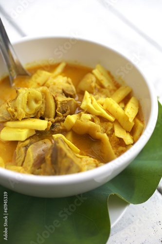 spicy yellow fish curry and green leaf