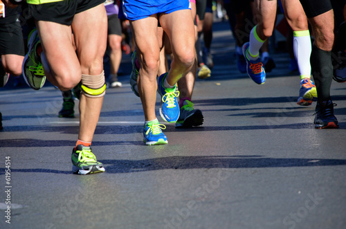 Marathon running race, people feet on road, sport concept