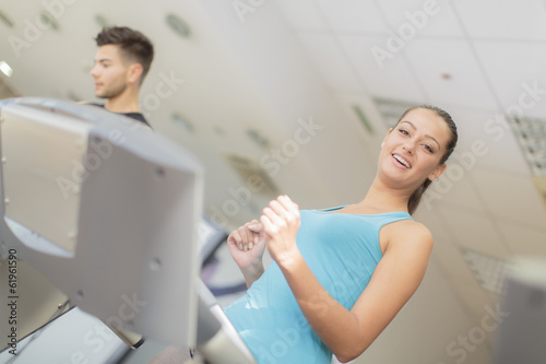 Young man and woman in the gym