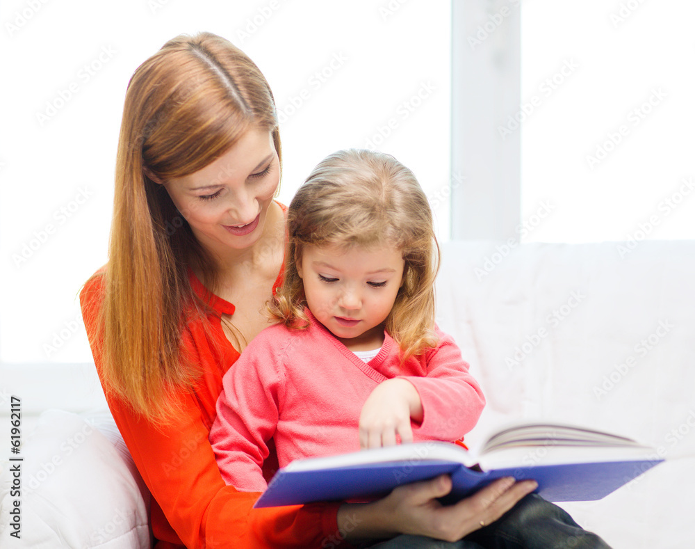 happy mother and daughter with book happy mother and daughter with book