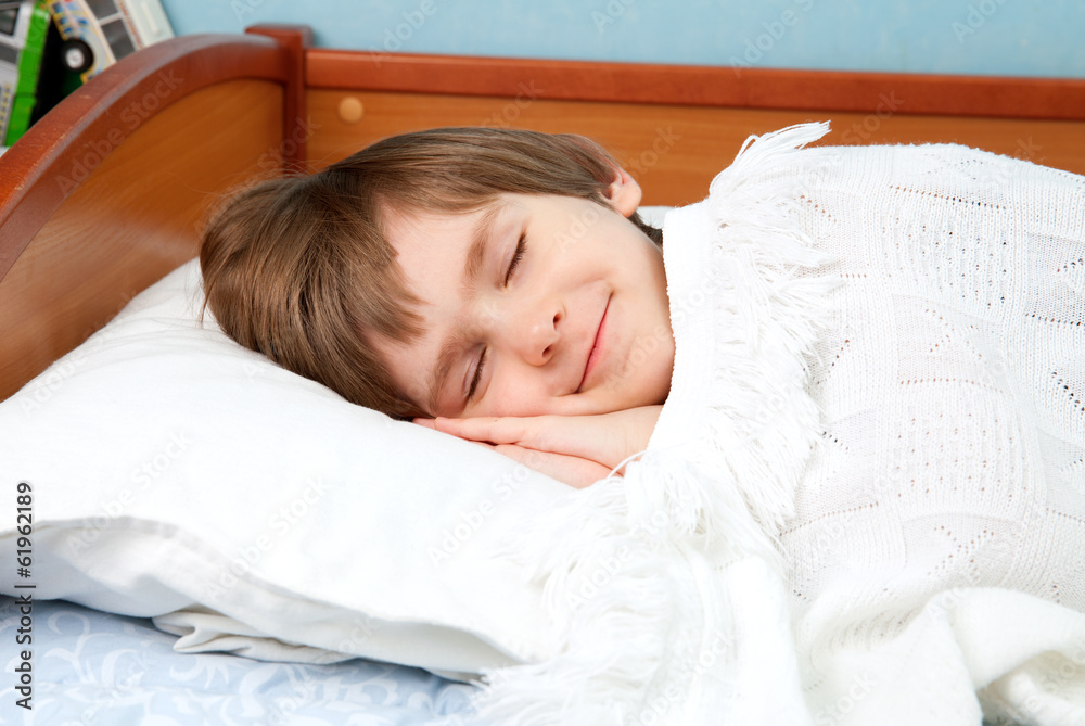 The small boy is sleeping The small boy is sleeping