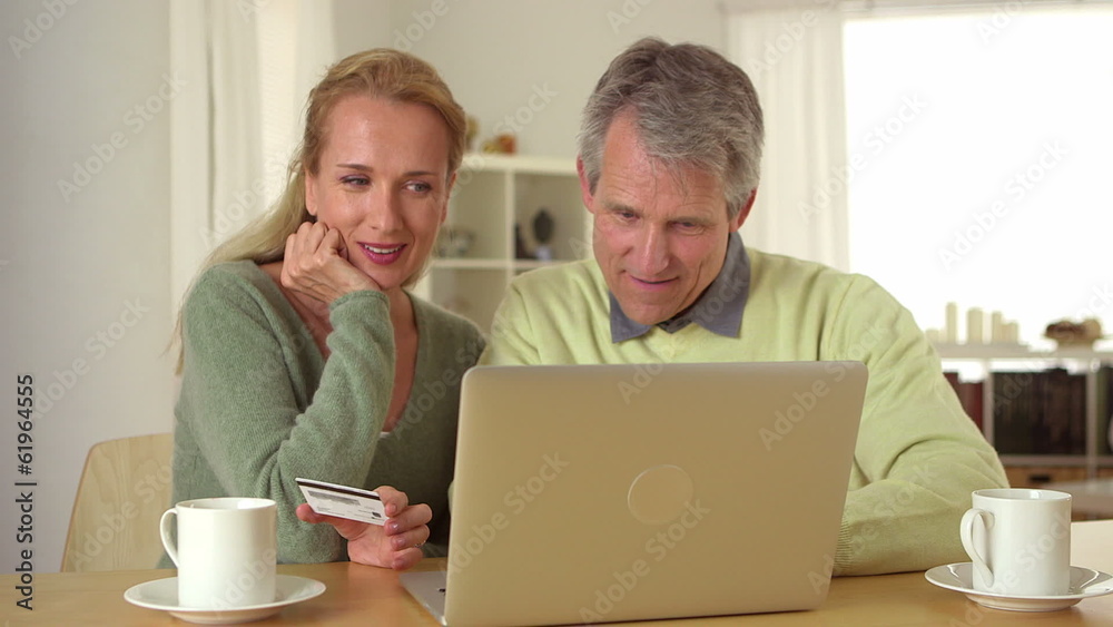 Mature couple planning vacation getaway Mature couple planning vacation getaway