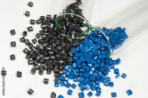 blue and black polymer pellets in test tubes