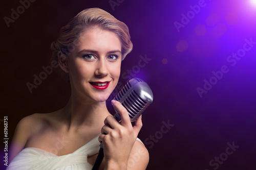 attractive female singer with microphone
