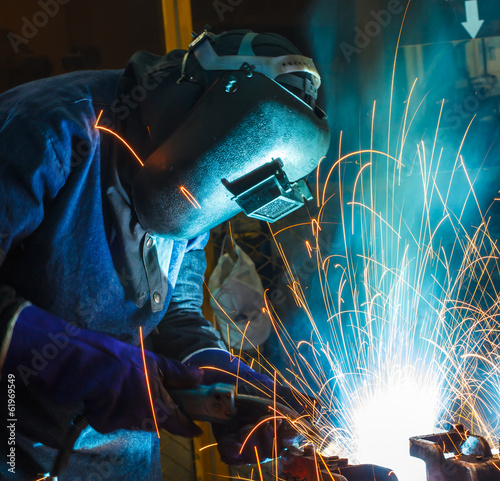 Konstfotografi People are working steel welding