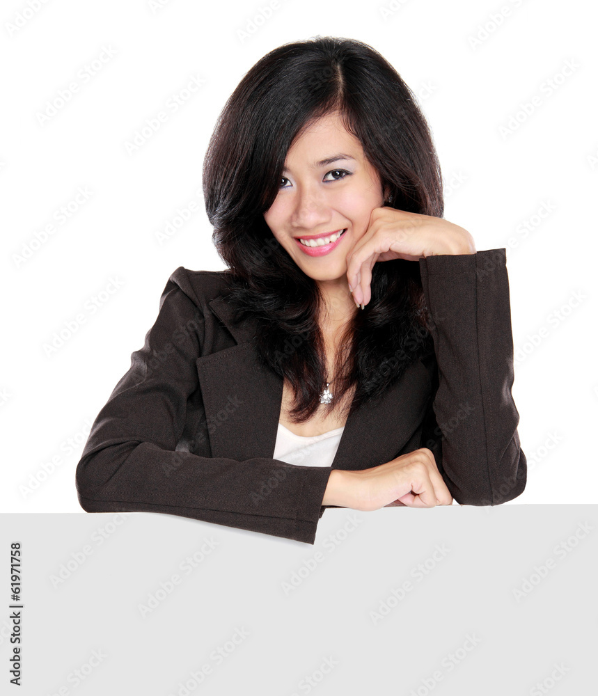 Businesswoman holding a blank presentation board Businesswoman holding a blank presentation board